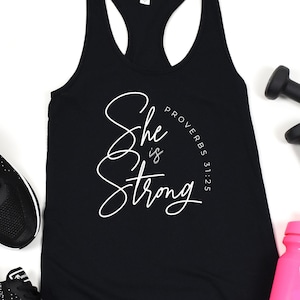 She Is Strong Workout Tank Top Womens Workout Shirt Religious Saying Tee Fitness Racerback Tank Feminism Gift Proverbs 31:25 Bible verse