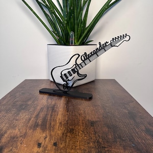 Electric guitar personalized and painted in line art. The perfect gift for electric guitar players. Made from organic plastic.