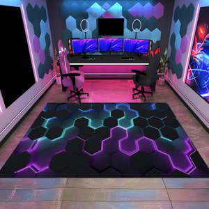 May include: A black and purple gaming rug with a hexagonal pattern and glowing neon lights. The rug is in front of a gaming setup with three monitors, two gaming chairs, and a desk with a pink neon light strip.