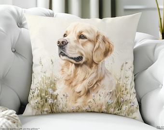 May include: A square throw pillow featuring a detailed illustration of a golden retriever dog sitting in a field of tall grass and small light purple flowers. The dog has light golden fur and is looking toward the left side of the frame.