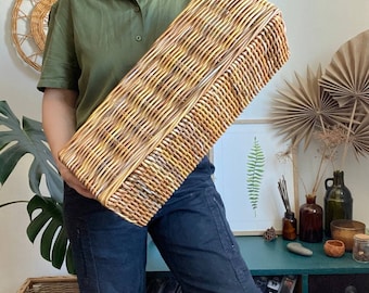 Long wicker basket. Brown storage basket. Rectangular basket.