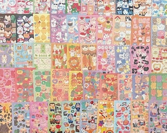 Könnte beinhalten: Ein Set mit 36 bunten Stickerbögen mit niedlichen Comic-Tieren, Essen und Gegenständen. Jedes Blatt hat ein anderes Design und ist perfekt zum Dekorieren von Planern, Tagebüchern und anderen Gegenständen.