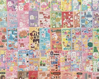 May include: A sheet of colorful stickers featuring various cute animal illustrations, including bears, rabbits, and other creatures. The stickers are arranged in a grid pattern and include text like "Game", "Boom", and "Style".