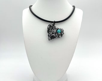 Curly heart pendant in black and silver with an original turquoise Swarovski stone