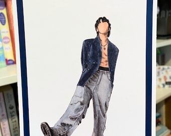May include: Watercolor illustration of a person in a navy blue blazer, gray jeans, and black shoes. The artwork is on white paper with a navy blue border. The person is depicted with a faceless head and a necklace.
