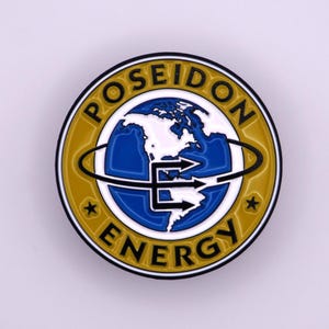 May include: A round, yellow, blue, and white Poseidon Energy emblem. The emblem features a globe with the text "POSEIDON ENERGY" in a circular pattern. The globe has a white outline of the continents and a blue ocean.