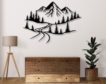 May include: Black metal wall art depicting a mountain range with a winding road leading through the trees. The art is mounted on a white wall above a wooden dresser.