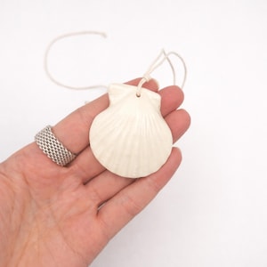 May include: A rustic wooden sign with the text "Welcome to our home" in white lettering. The sign features a distressed finish and a simple, inviting design, perfect for front door decor.