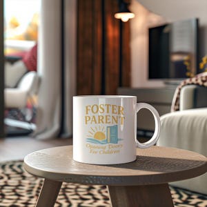 May include: A white ceramic mug with a black handle and the text "But First, Coffee" in a black, bold font. The mug is on a white surface.