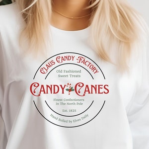 Claus Candy Cane Factory Unisex T-Shirt, Christmas Long Sleeve, Christmas Candy, Santa Candy Label, Candy Cane T-Shirt, Christmas Gift