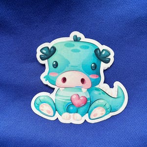 Cute Baby Dragon Sticker – Teal Fantasy Creature with Heart Vinyl Decal for Laptops, Water Bottles, Journals & More
