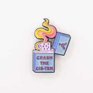 May include: A blue and purple enamel pin shaped like a lighter with a flame coming out of the top. The lighter says "Crash the Cis-tem" in red letters.