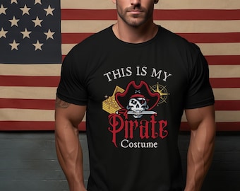 May include: A black t-shirt with a pirate skull and crossbones graphic and the text "This is my Pirate Costume".
