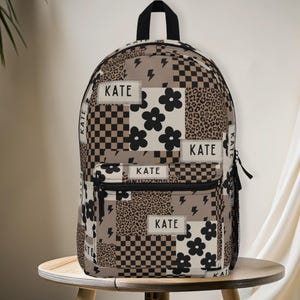 Custom girl backpack with leopard checkered print, personalized with name for a unique touch. This girl name backpack is a fun teen gift idea, perfect for back to school or everyday use. Personalized kids backpack with cheetah design for stylish school bag flair. Great for students who love animal prints.