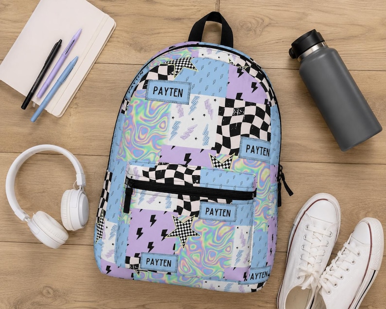 Pastel checkered backpack featuring a customizable name and modern colorful design. Durable everyday bag perfect for school, travel, sleepovers, and extracurricular activities. Comfortable backpack for kids and teens who love trendy, personalized accessories.