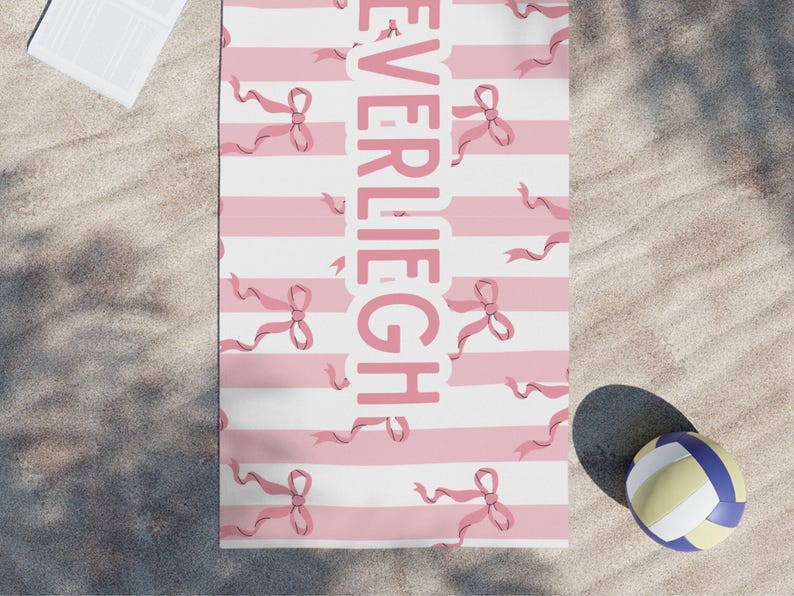 Custom name coquette bow beach towel in a stylish design, perfect for girls, teens, and kids. A personalized pool towel ideal for spring break, vacations, and bachelorette gifts. This trendy custom color towel makes a great gift idea for any occasion.