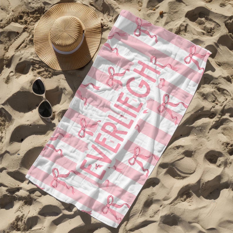 Custom name coquette bow beach towel in a stylish design, perfect for girls, teens, and kids. A personalized pool towel ideal for spring break, vacations, and bachelorette gifts. This trendy custom color towel makes a great gift idea for any occasion.