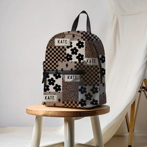 Custom girl backpack with leopard checkered print, personalized with name for a unique touch. This girl name backpack is a fun teen gift idea, perfect for back to school or everyday use. Personalized kids backpack with cheetah design for stylish school bag flair. Great for students who love animal prints.