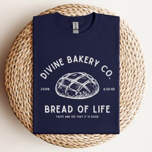 Faith-based sourdough t-shirt with a Bible verse, perfect for a birthday gift for her or a sourdough-themed gift for a friend. This Christian baking shirt is a great sourdough gift for bread lovers who enjoy faith-inspired apparel and scripture-based designs.