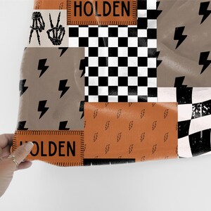 This custom boy baby blanket features a personalized name with a cool skeleton hand and lightning bolt design, adding a fun, spooky touch to nursery decor. It’s the perfect cozy kids blanket for fall, Halloween, or year-round for boys who love edgy style. This unique personalized blanket makes a great boy gift idea and brings playful, cool vibes to any boy’s room or nursery