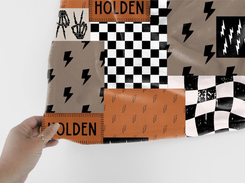 This custom boy baby blanket features a personalized name with a cool skeleton hand and lightning bolt design, adding a fun, spooky touch to nursery decor. It’s the perfect cozy kids blanket for fall, Halloween, or year-round for boys who love edgy style. This unique personalized blanket makes a great boy gift idea and brings playful, cool vibes to any boy’s room or nursery
