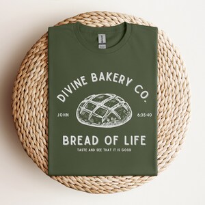 Faith-based sourdough t-shirt with a Bible verse, perfect for a birthday gift for her or a sourdough-themed gift for a friend. This Christian baking shirt is a great sourdough gift for bread lovers who enjoy faith-inspired apparel and scripture-based designs.