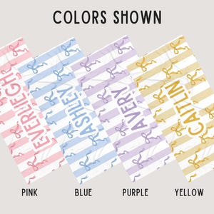 May include: Four personalized towels with different names and colors. The towels are pink, blue, purple, and yellow with white stripes and a bow pattern. The names on the towels are Everleigh, Ashley, Avery, and Caitlin.