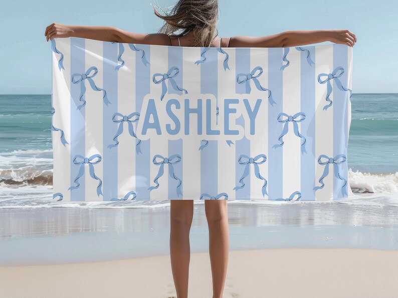 Custom name coquette bow beach towel in a stylish design, perfect for girls, teens, and kids. A personalized pool towel ideal for spring break, vacations, and bachelorette gifts. This trendy custom color towel makes a great gift idea for any occasion.