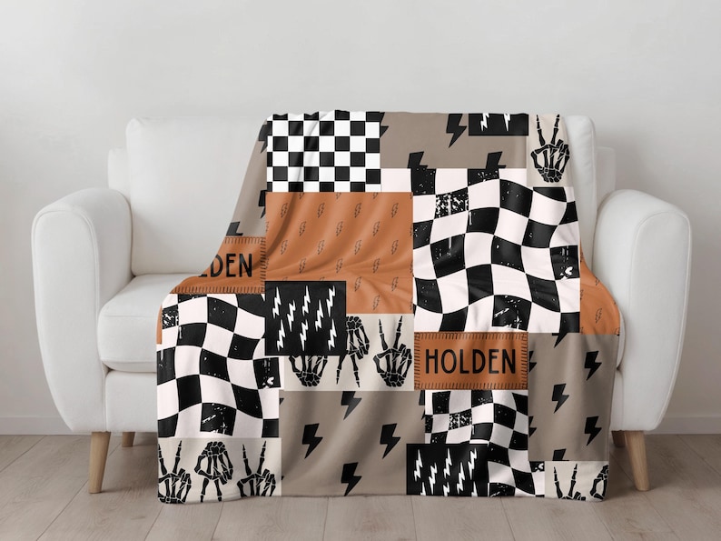 This custom boy baby blanket features a personalized name with a cool skeleton hand and lightning bolt design, adding a fun, spooky touch to nursery decor. It’s the perfect cozy kids blanket for fall, Halloween, or year-round for boys who love edgy style. This unique personalized blanket makes a great boy gift idea and brings playful, cool vibes to any boy’s room or nursery