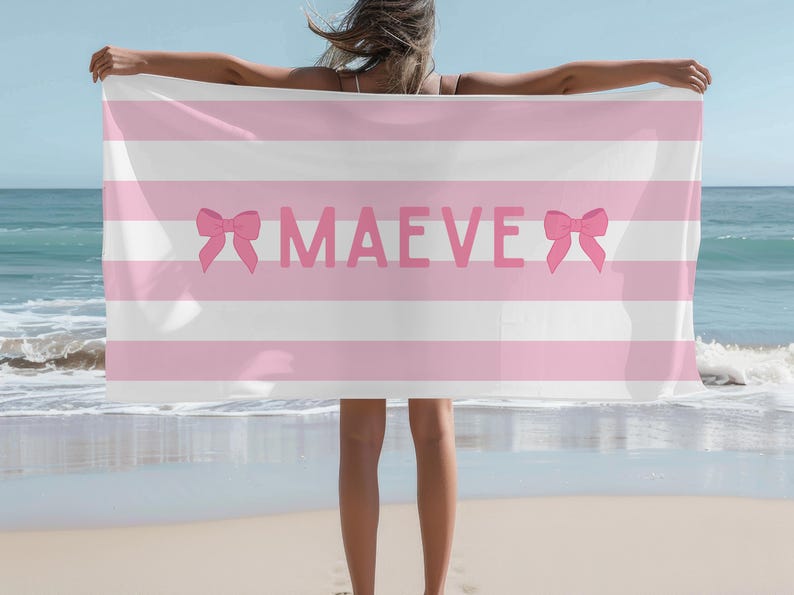 This custom coquette bow beach towel is the perfect blend of style and function for kids and teens. Designed with a personalized name and trendy bow detail, this custom pool towel makes a great vacation towel gift or summer accessory. Soft and absorbent, it’s ideal for beach days, poolside lounging, and travel, making it a fun and unique gift idea for girls!