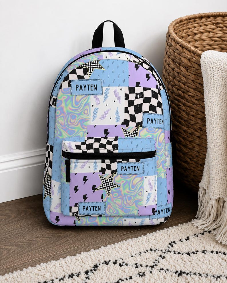Pastel checkered backpack featuring a customizable name and modern colorful design. Durable everyday bag perfect for school, travel, sleepovers, and extracurricular activities. Comfortable backpack for kids and teens who love trendy, personalized accessories.