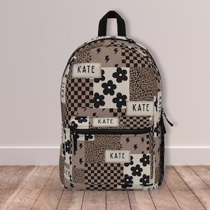 Custom girl backpack with leopard checkered print, personalized with name for a unique touch. This girl name backpack is a fun teen gift idea, perfect for back to school or everyday use. Personalized kids backpack with cheetah design for stylish school bag flair. Great for students who love animal prints.
