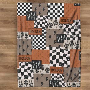 This custom boy baby blanket features a personalized name with a cool skeleton hand and lightning bolt design, adding a fun, spooky touch to nursery decor. It’s the perfect cozy kids blanket for fall, Halloween, or year-round for boys who love edgy style. This unique personalized blanket makes a great boy gift idea and brings playful, cool vibes to any boy’s room or nursery