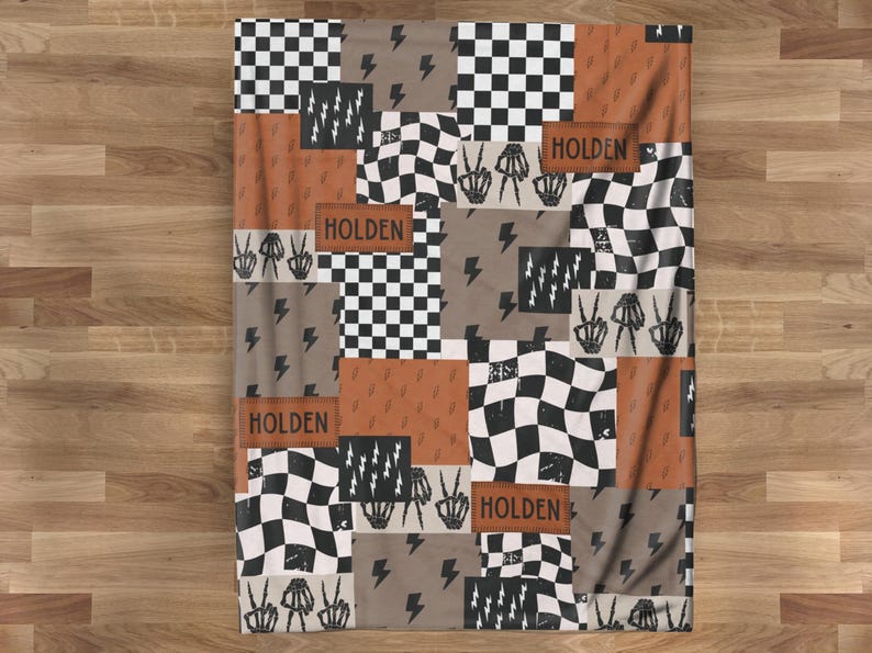 This custom boy baby blanket features a personalized name with a cool skeleton hand and lightning bolt design, adding a fun, spooky touch to nursery decor. It’s the perfect cozy kids blanket for fall, Halloween, or year-round for boys who love edgy style. This unique personalized blanket makes a great boy gift idea and brings playful, cool vibes to any boy’s room or nursery