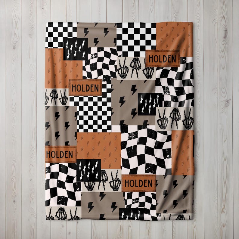 This custom boy baby blanket features a personalized name with a cool skeleton hand and lightning bolt design, adding a fun, spooky touch to nursery decor. It’s the perfect cozy kids blanket for fall, Halloween, or year-round for boys who love edgy style. This unique personalized blanket makes a great boy gift idea and brings playful, cool vibes to any boy’s room or nursery