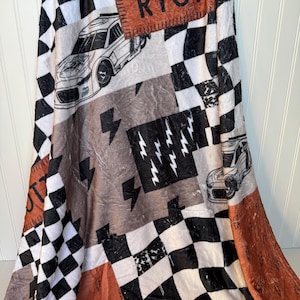 Racing Blanket Custom Name Blanket featuring a bold race car design with personalized name detail. This Personalized Race Car Gift Idea Toddler Boy Gift works as custom bedding gift and statement racing room decor. Perfect for car-loving kids and teens, this cozy blanket makes a thoughtful Teen Boy Gift Idea for birthdays, holidays, or special occasions while adding fun racing style to a boy bedroom.