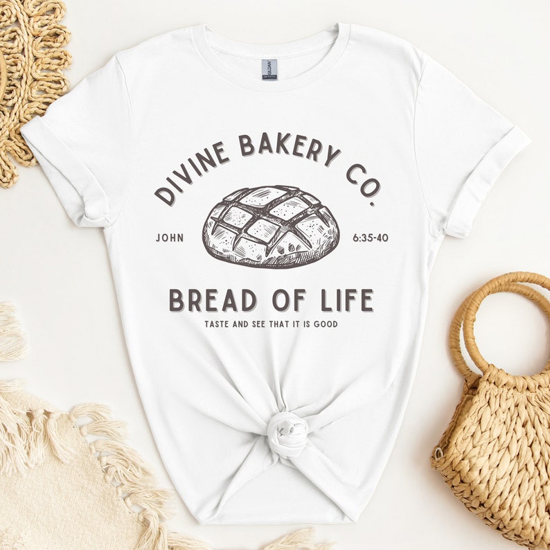 Faith-based sourdough t-shirt with a Bible verse, perfect for a birthday gift for her or a sourdough-themed gift for a friend. This Christian baking shirt is a great sourdough gift for bread lovers who enjoy faith-inspired apparel and scripture-based designs.
