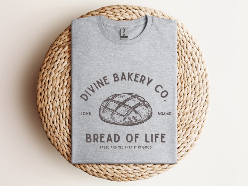 Faith-based sourdough t-shirt with a Bible verse, perfect for a birthday gift for her or a sourdough-themed gift for a friend. This Christian baking shirt is a great sourdough gift for bread lovers who enjoy faith-inspired apparel and scripture-based designs.
