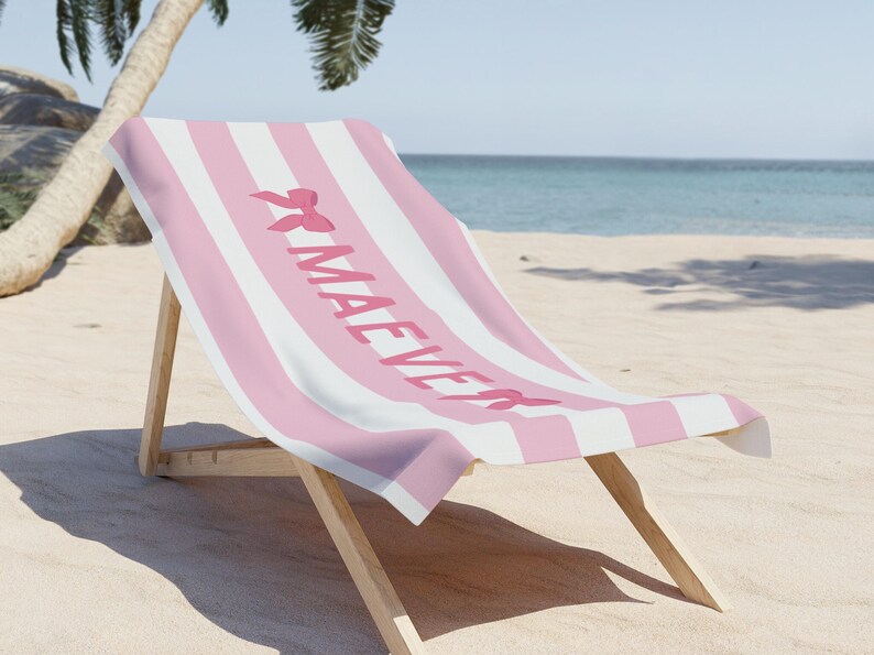 This custom coquette bow beach towel is the perfect blend of style and function for kids and teens. Designed with a personalized name and trendy bow detail, this custom pool towel makes a great vacation towel gift or summer accessory. Soft and absorbent, it’s ideal for beach days, poolside lounging, and travel, making it a fun and unique gift idea for girls!