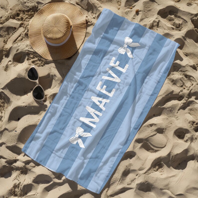 This custom coquette bow beach towel is the perfect blend of style and function for kids and teens. Designed with a personalized name and trendy bow detail, this custom pool towel makes a great vacation towel gift or summer accessory. Soft and absorbent, it’s ideal for beach days, poolside lounging, and travel, making it a fun and unique gift idea for girls!