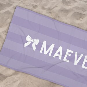 This custom coquette bow beach towel is the perfect blend of style and function for kids and teens. Designed with a personalized name and trendy bow detail, this custom pool towel makes a great vacation towel gift or summer accessory. Soft and absorbent, it’s ideal for beach days, poolside lounging, and travel, making it a fun and unique gift idea for girls!