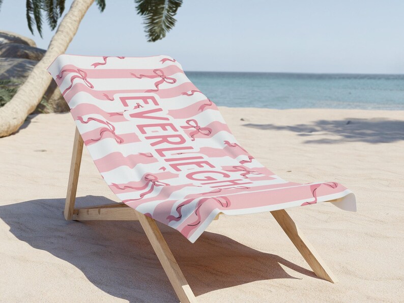 Custom name coquette bow beach towel in a stylish design, perfect for girls, teens, and kids. A personalized pool towel ideal for spring break, vacations, and bachelorette gifts. This trendy custom color towel makes a great gift idea for any occasion.