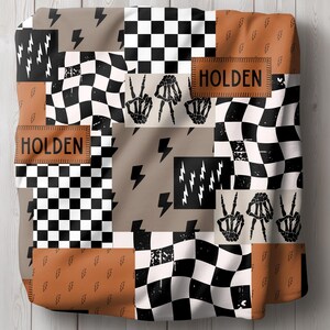 This custom boy baby blanket features a personalized name with a cool skeleton hand and lightning bolt design, adding a fun, spooky touch to nursery decor. It’s the perfect cozy kids blanket for fall, Halloween, or year-round for boys who love edgy style. This unique personalized blanket makes a great boy gift idea and brings playful, cool vibes to any boy’s room or nursery
