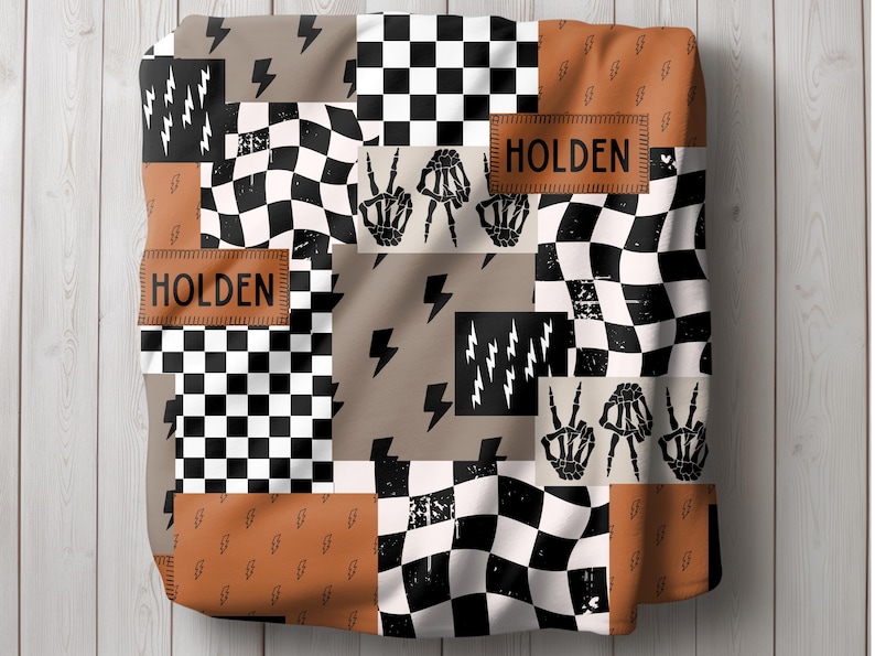 This custom boy baby blanket features a personalized name with a cool skeleton hand and lightning bolt design, adding a fun, spooky touch to nursery decor. It’s the perfect cozy kids blanket for fall, Halloween, or year-round for boys who love edgy style. This unique personalized blanket makes a great boy gift idea and brings playful, cool vibes to any boy’s room or nursery