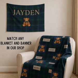 May include: A navy blue and green plaid blanket and wall banner with a teddy bear design. The banner has the name "JAYDEN" in gold lettering. The blanket features the name "HENRY" on several squares with teddy bear graphics.