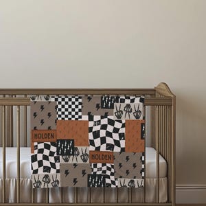 This custom boy baby blanket features a personalized name with a cool skeleton hand and lightning bolt design, adding a fun, spooky touch to nursery decor. It’s the perfect cozy kids blanket for fall, Halloween, or year-round for boys who love edgy style. This unique personalized blanket makes a great boy gift idea and brings playful, cool vibes to any boy’s room or nursery