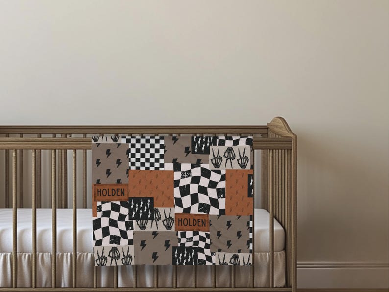 This custom boy baby blanket features a personalized name with a cool skeleton hand and lightning bolt design, adding a fun, spooky touch to nursery decor. It’s the perfect cozy kids blanket for fall, Halloween, or year-round for boys who love edgy style. This unique personalized blanket makes a great boy gift idea and brings playful, cool vibes to any boy’s room or nursery