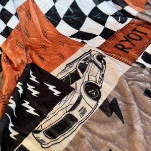 Racing Blanket Custom Name Blanket featuring a bold race car design with personalized name detail. This Personalized Race Car Gift Idea Toddler Boy Gift works as custom bedding gift and statement racing room decor. Perfect for car-loving kids and teens, this cozy blanket makes a thoughtful Teen Boy Gift Idea for birthdays, holidays, or special occasions while adding fun racing style to a boy bedroom.