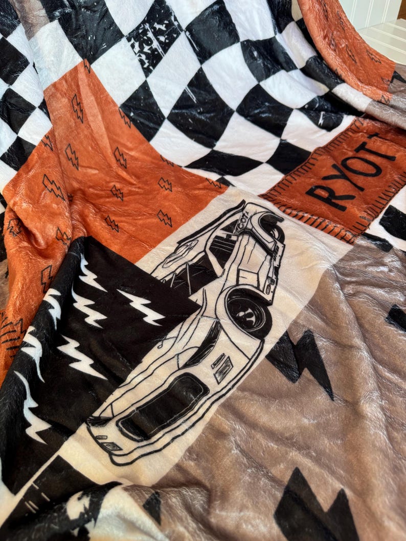 Racing Blanket Custom Name Blanket featuring a bold race car design with personalized name detail. This Personalized Race Car Gift Idea Toddler Boy Gift works as custom bedding gift and statement racing room decor. Perfect for car-loving kids and teens, this cozy blanket makes a thoughtful Teen Boy Gift Idea for birthdays, holidays, or special occasions while adding fun racing style to a boy bedroom.