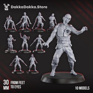 Op de afbeelding: Een set van 10 ongeverfde grijze miniatuurfiguren die verschillende zombiepersonages in dynamische houdingen weergeven. Elk figuur staat op een ronde zwarte basis. De tekst DakkaDakka.Store en 30 MM FROM FEET TO EYES is zichtbaar.
